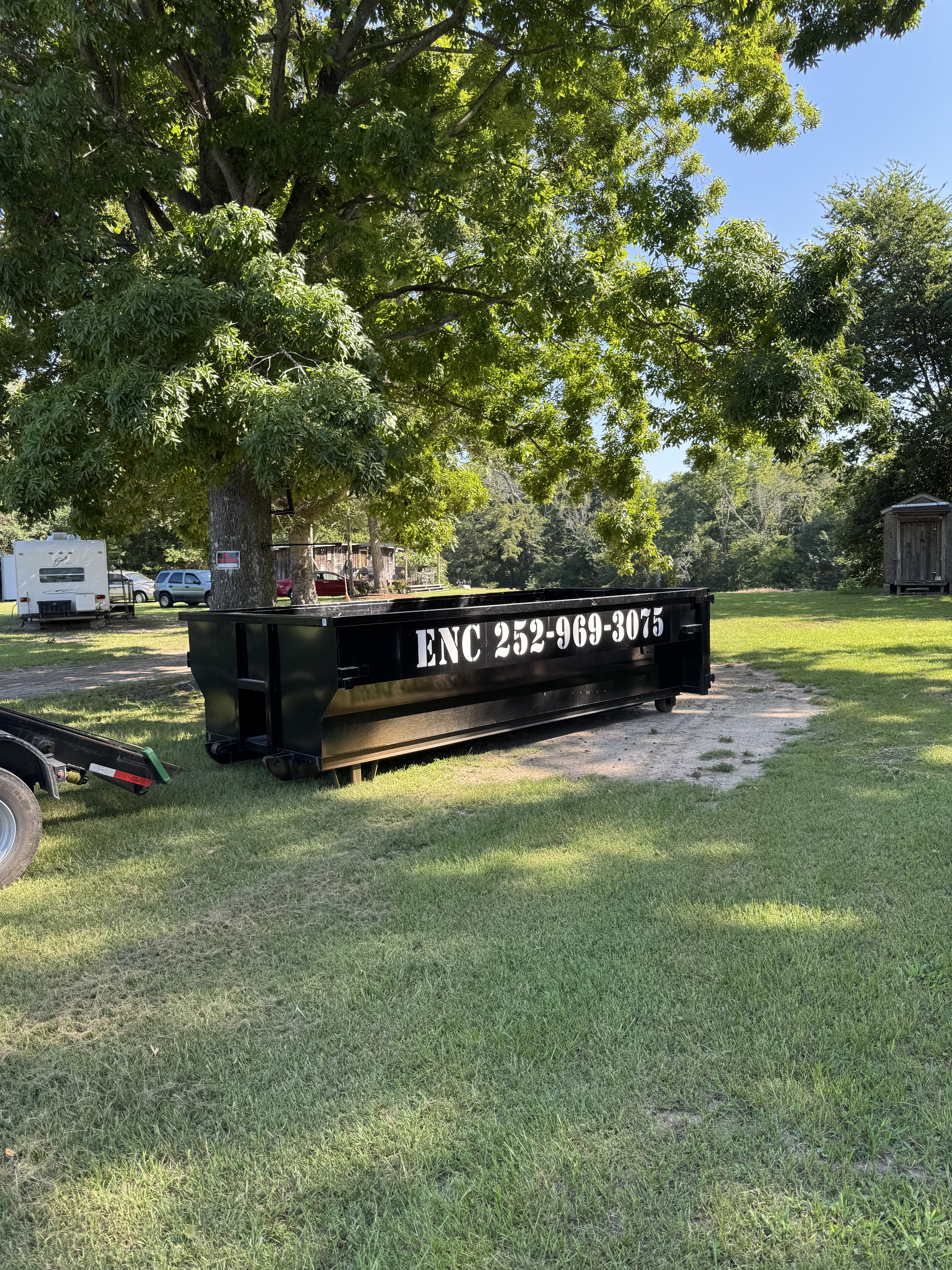 ENC Dumpster with driveway protection boards